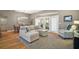 Comfortable living room featuring a dining table and natural light shining through French doors that open to the exterior at 5557 Freeport Dr, Tavares, FL 32778