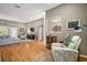 Spacious living room filled with natural light, with hardwood floors and a comfortable seating arrangement at 5557 Freeport Dr, Tavares, FL 32778