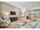 Open-concept layout connecting the living room to the entry with large windows for natural light at 5557 Freeport Dr, Tavares, FL 32778