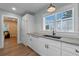 Bright kitchen featuring updated countertops, cabinets, and modern fixtures at 602 Ross St, Leesburg, FL 34748