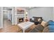 Stylish living room featuring a decorative fireplace, mantle and cozy seating area at 602 Ross St, Leesburg, FL 34748