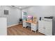 Office space with wood-look floors and bright natural light at 602 Ross St, Leesburg, FL 34748