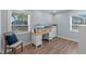Sunlit office space with wood-look floors, large windows, and bright natural light at 602 Ross St, Leesburg, FL 34748