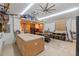 Well-equipped workshop with ample workspace, organization, and ceiling fan at 602 Ross St, Leesburg, FL 34748