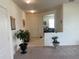 Inviting foyer featuring tile and carpet flooring and natural light at 709 Sarner Pass Way, Winter Haven, FL 33881