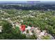 Expansive aerial view showcases property location near Downtown Deland, enveloped by lush greenery and neighborhood streets at 726 S Stone St, Deland, FL 32720