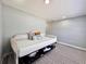 Bedroom featuring a daybed with decorative pillows, storage, and patterned area rug at 726 S Stone St, Deland, FL 32720