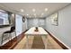 Bright dining room showcases a white table, recessed lighting, and an area rug on hardwood flooring at 726 S Stone St, Deland, FL 32720