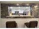 The pass through creates an open concept dining room with granite bar and seating at 726 S Stone St, Deland, FL 32720