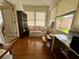 Bright sunroom with laminate floors, large windows, and a comfortable seating area perfect for relaxing at 728 Ramirez Ave, The Villages, FL 32159