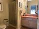 Well-lit bathroom with a walk-in shower and vanity with countertop space at 728 Ramirez Ave, The Villages, FL 32159