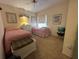 Inviting bedroom with plush carpeting, twin beds, and a light and airy ambiance at 728 Ramirez Ave, The Villages, FL 32159
