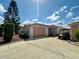 Charming single-story home with a well-manicured lawn, a two-car garage and inviting curb appeal at 728 Ramirez Ave, The Villages, FL 32159