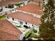 Aerial view showing the home's patio with outdoor seating and mature landscaping at 728 Ramirez Ave, The Villages, FL 32159