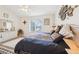 Relaxing bedroom with carpet features dresser, chair, window view, and decoratively-framed hanging art at 8043 Pine Hollow Dr, Mount Dora, FL 32757