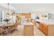 Bright kitchen features tile floors, island, lots of storage, and eating area with natural light at 8043 Pine Hollow Dr, Mount Dora, FL 32757