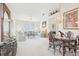 Open living area with elegant decor, plush seating, and ample space for entertaining at 8043 Pine Hollow Dr, Mount Dora, FL 32757