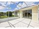 Spacious screened patio with tile flooring, perfect for outdoor entertaining and relaxation with seamless indoor-outdoor flow at 8043 Pine Hollow Dr, Mount Dora, FL 32757