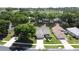 Homes with well-maintained lawns and a glimpse of the nearby golf course at 860 Wolf Creek St, Clermont, FL 34711