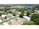 Overview of neighborhood homes, showcasing mature trees and the nearby lake at 860 Wolf Creek St, Clermont, FL 34711