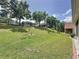 Picturesque backyard with lush green grass and landscaping at 860 Wolf Creek St, Clermont, FL 34711