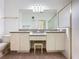 Bathroom features double sinks, vanity, and a large mirror at 860 Wolf Creek St, Clermont, FL 34711