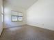 Bedroom featuring carpet and a large window at 860 Wolf Creek St, Clermont, FL 34711