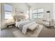 Stylishly decorated bedroom features a large window, carpet, and bedside lamps at 860 Wolf Creek St, Clermont, FL 34711