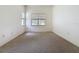 Bright bedroom featuring carpet and a large window at 860 Wolf Creek St, Clermont, FL 34711