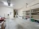 Spacious garage with ample storage and shelving at 860 Wolf Creek St, Clermont, FL 34711