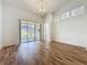 Bright living room boasts wood floors, ample natural light, and high ceilings at 860 Wolf Creek St, Clermont, FL 34711