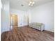 Inviting living room with hardwood floors, a high ceiling, and a comfortable striped sofa at 860 Wolf Creek St, Clermont, FL 34711