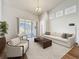 Bright living room with soaring ceilings, lots of natural light, and sophisticated decor at 860 Wolf Creek St, Clermont, FL 34711