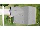 Drone's-eye view displays the roof's condition and the surrounding yard of the property at 860 Wolf Creek St, Clermont, FL 34711