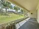 Open sunroom with large window screens and ample natural light at 860 Wolf Creek St, Clermont, FL 34711