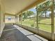 Spacious sunroom with sliding windows and great views of backyard at 860 Wolf Creek St, Clermont, FL 34711