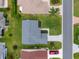 Aerial view of the home shows the roof, driveway and landscaping at 870 Danforth Ct, The Villages, FL 32162