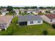 Aerial view of backyard with a screened lanai at 870 Danforth Ct, The Villages, FL 32162