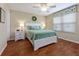 Comfortable bedroom featuring a ceiling fan, window with blinds, and coordinated decor at 870 Danforth Ct, The Villages, FL 32162