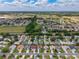 Wide angle aerial view of the community with beautiful landscaping and street layout at 870 Danforth Ct, The Villages, FL 32162