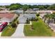 Well maintained front exterior of a home with mature landscaping and a driveway at 870 Danforth Ct, The Villages, FL 32162