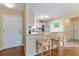 Bright kitchen featuring a breakfast bar and stainless steel appliances at 870 Danforth Ct, The Villages, FL 32162