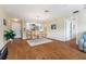 Open-concept living room flows seamlessly into the kitchen, providing ample space for dining and entertaining at 870 Danforth Ct, The Villages, FL 32162