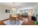Open concept living and dining area with hardwood floors and lots of natural light at 870 Danforth Ct, The Villages, FL 32162