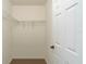A walk-in closet featuring carpet flooring, white walls, and wire shelving for optimal storage and organization at 870 Danforth Ct, The Villages, FL 32162
