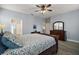 Spacious main bedroom featuring hardwood flooring and a ceiling fan at 879 Lucky Ln, The Villages, FL 32162