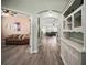 Inviting foyer with hardwood floors and ample natural light flowing into the living spaces at 879 Lucky Ln, The Villages, FL 32162