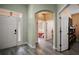 Inviting home foyer featuring hardwood flooring and archway accents at 879 Lucky Ln, The Villages, FL 32162