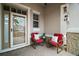 Cozy covered front porch with seating, perfect for relaxing and enjoying the outdoors at 879 Lucky Ln, The Villages, FL 32162