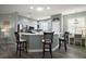 Well-equipped kitchen with stainless steel appliances, breakfast bar, and ample counter space at 879 Lucky Ln, The Villages, FL 32162